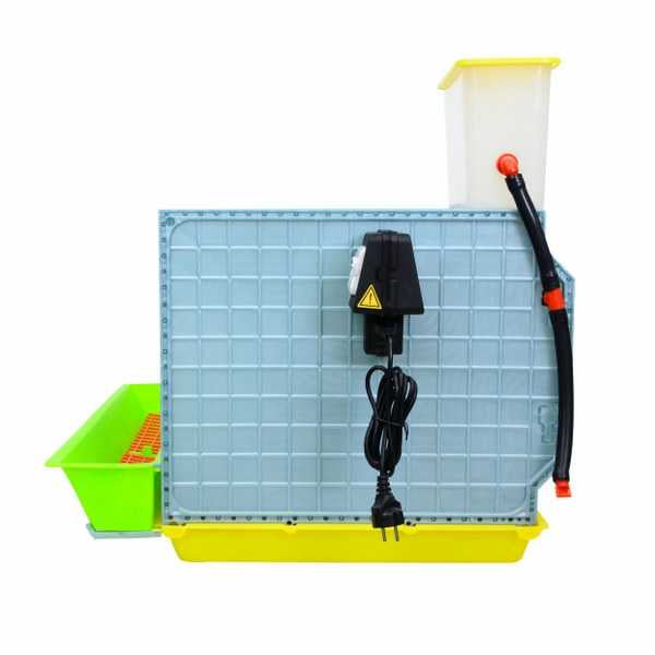Baby chick brooder setup with removable droppings tray for routine cleaning.