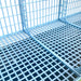 Deep sliding manure collection trays underneath the Cimuka 15-inch grow-out pen.