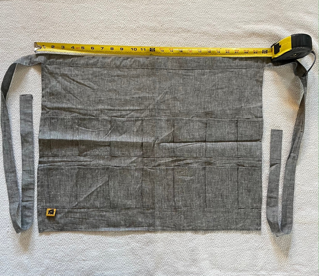 Grey denim egg collecting apron with 14 egg pockets