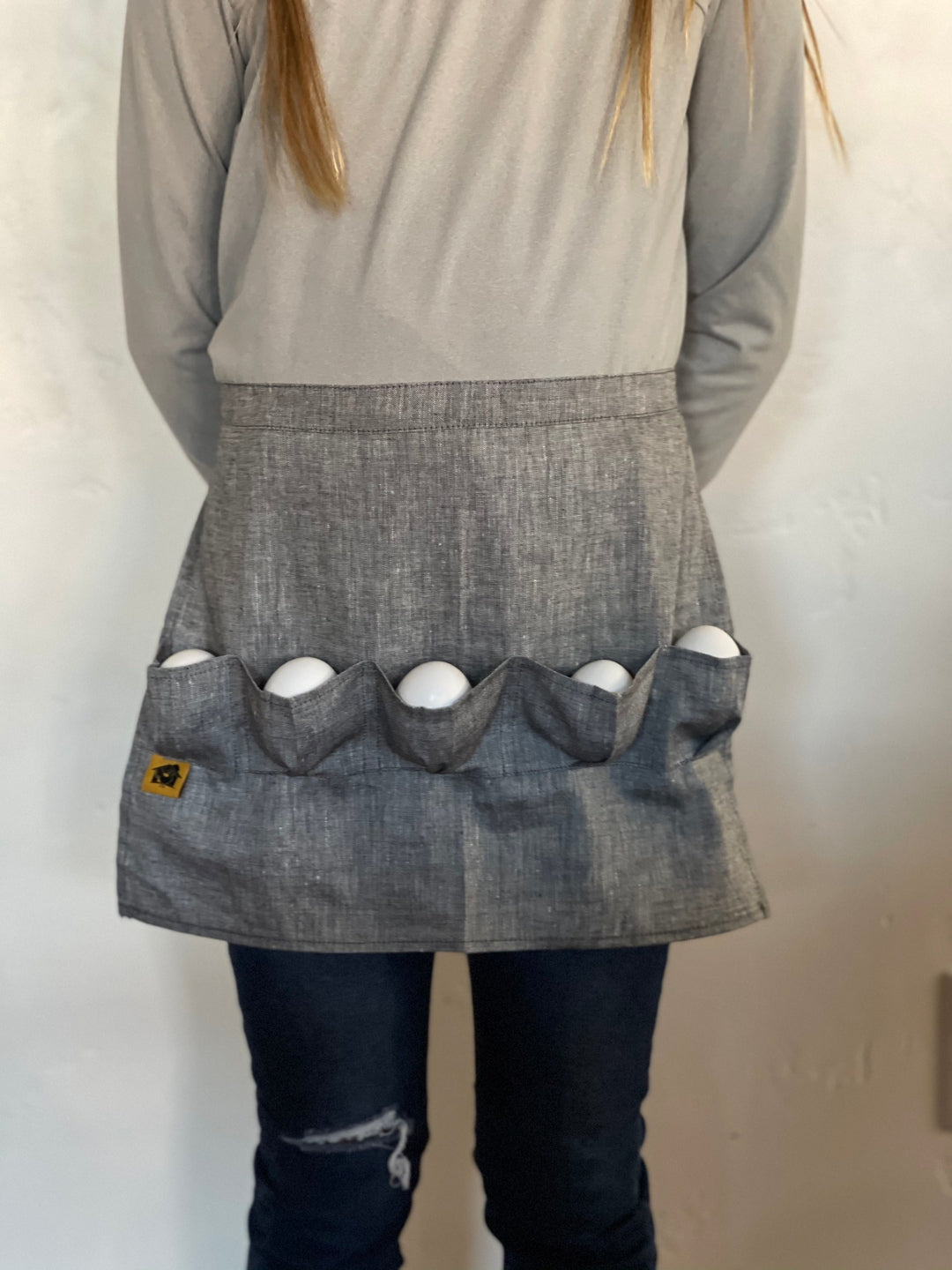Grey denim egg collecting apron with 5 egg pockets