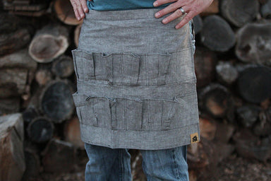 Grey denim egg collecting apron with egg pockets
