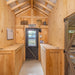 Multibreed Coop with Central Feed Room A1250CRGD | Hen House Collection inside view of man door