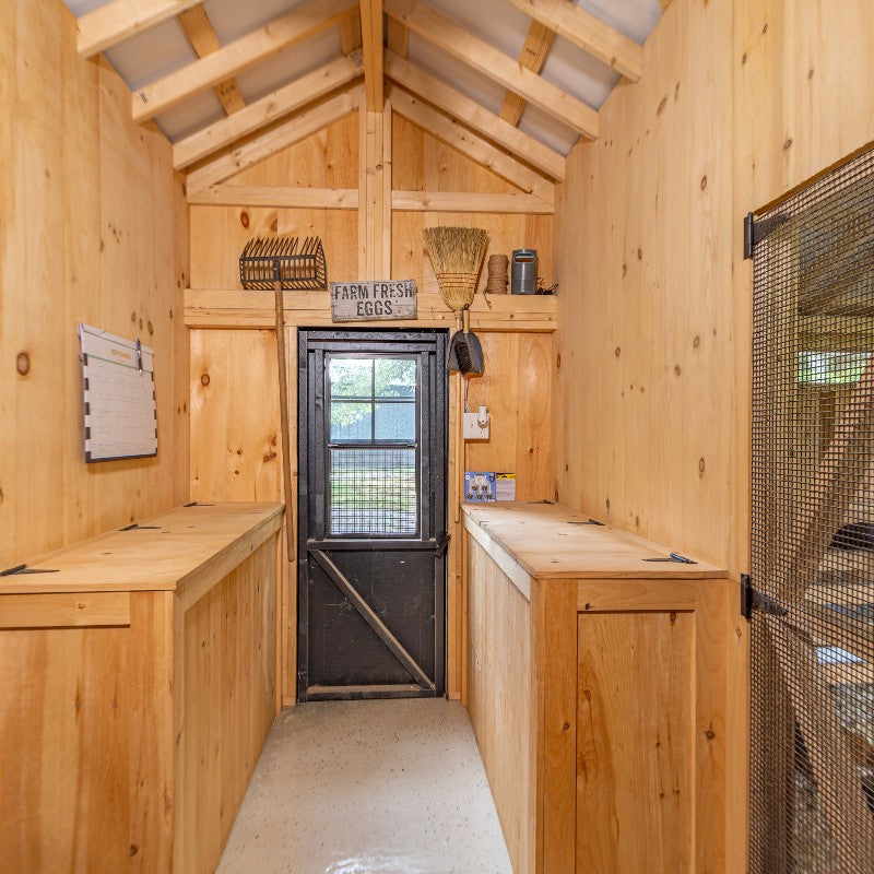 Multibreed Coop with Central Feed Room A1250CRGD | Hen House Collection inside view of man door