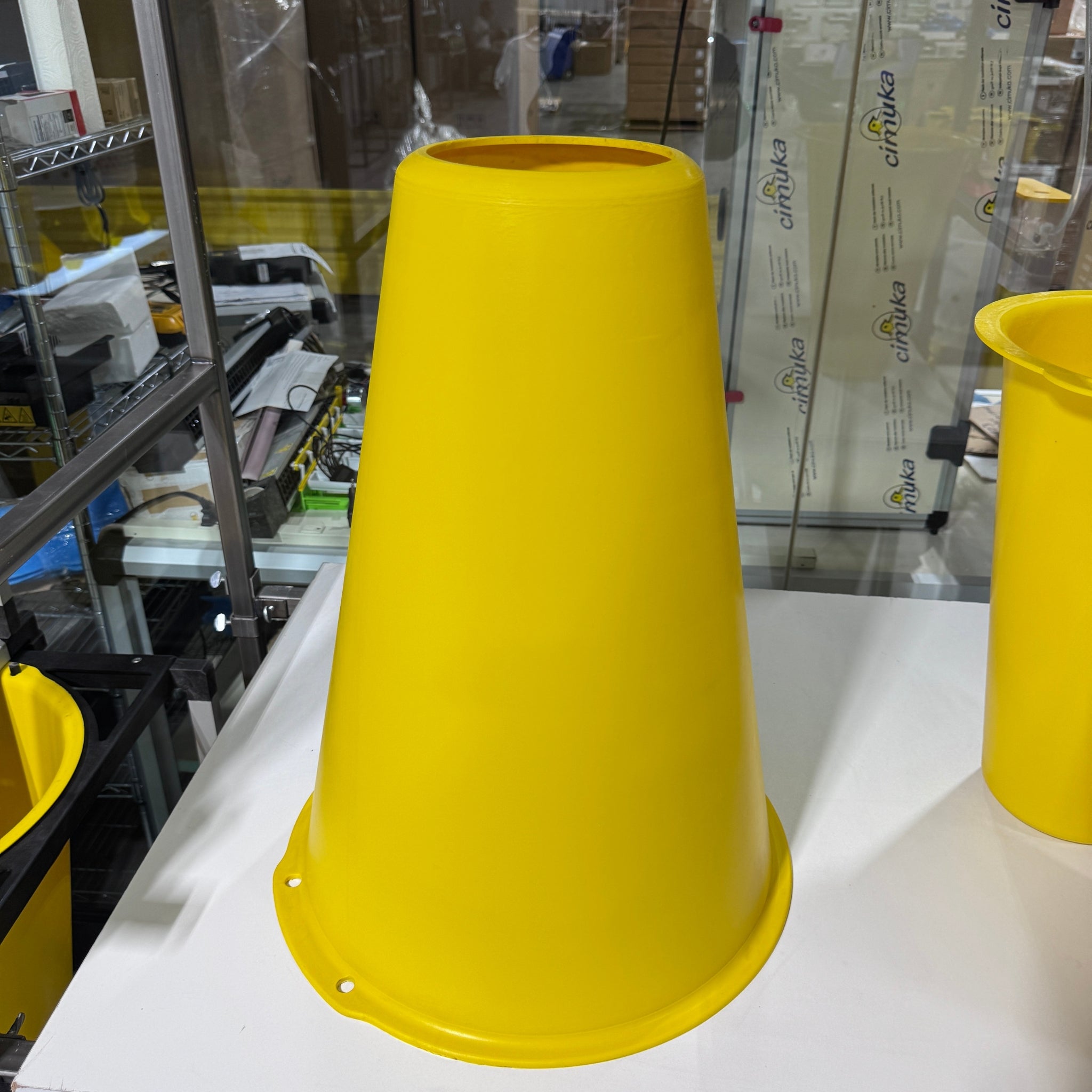 Plastic poultry slaughtering cone designed to restrain birds during processing.