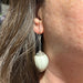 Quail Egg Earring on a woman's ear