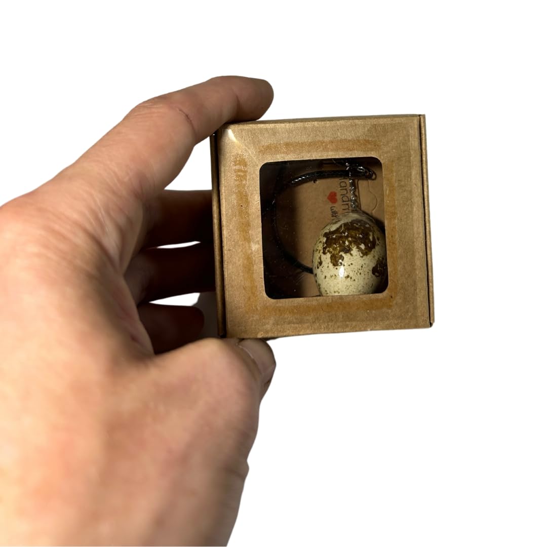 Quail Egg Necklace in its packaging box