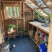 CedarShed Sunhouse inside with bench and plants