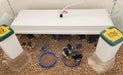 Sweeter Heater side-mount brooder heater installed on a coop wall