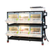 Two-layer Cimuka poultry brooder with integrated heaters, feeders, and gravity-fed drinkers.